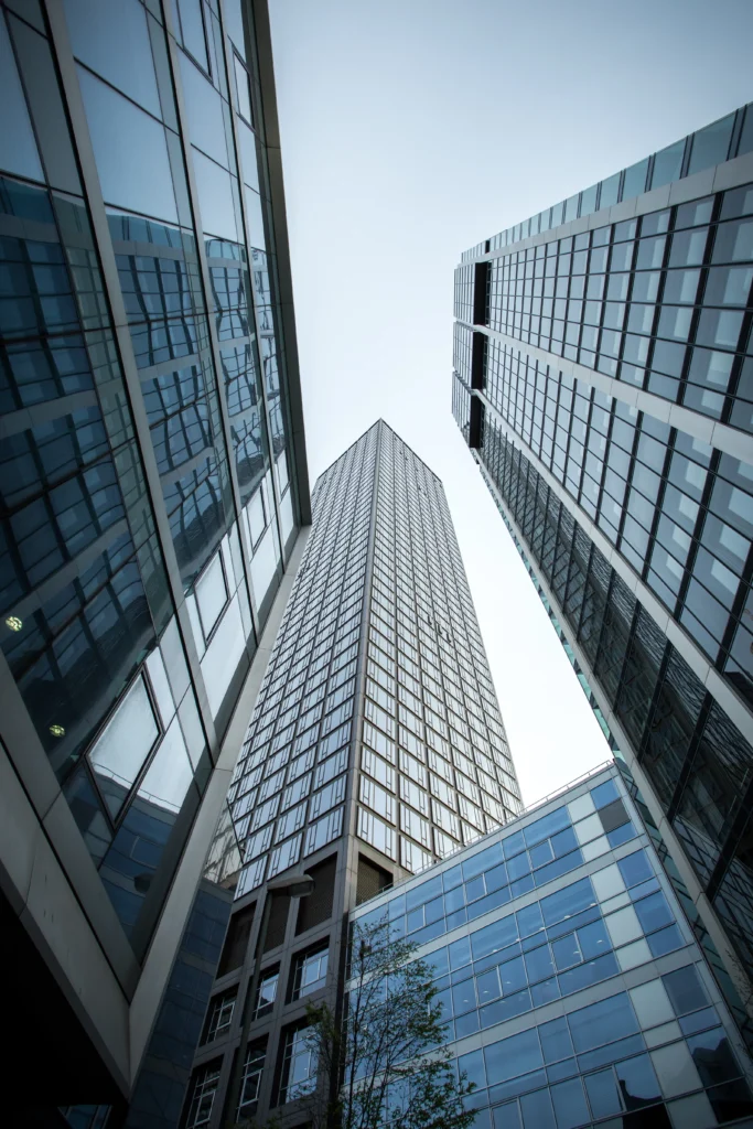 vertical low angle shot high rise skyscrapers glass facade frankfurt germany